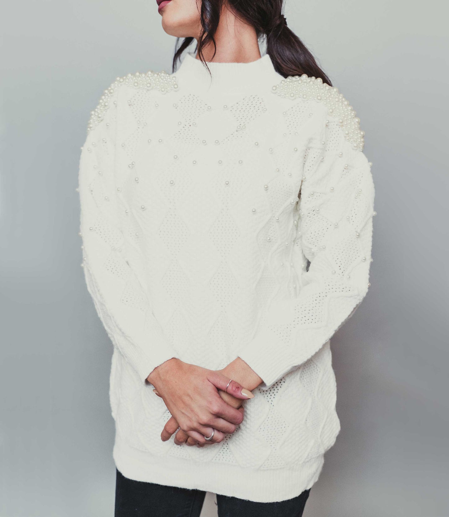 black jumper with mock pearls