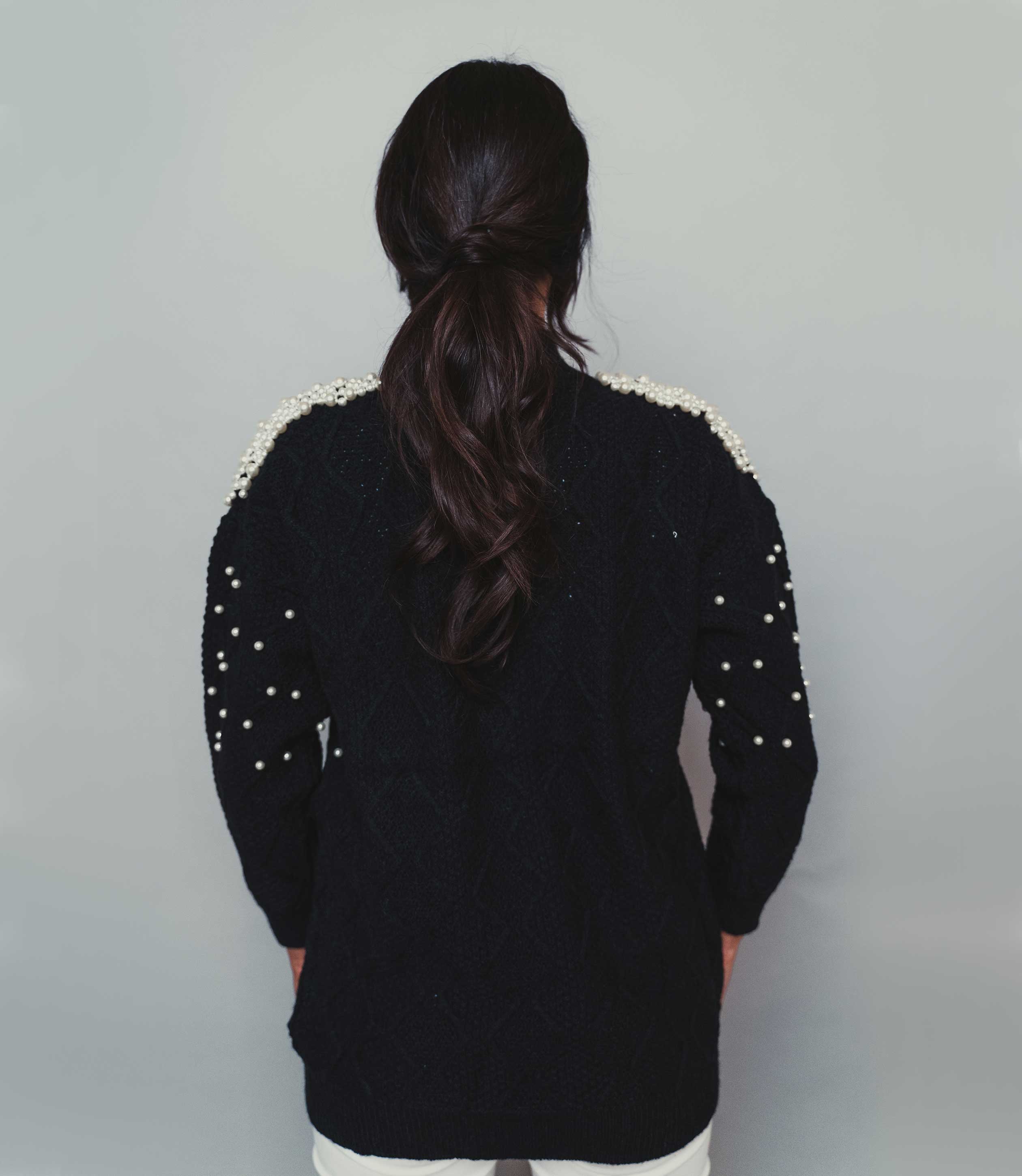 black jumper with mock pearls